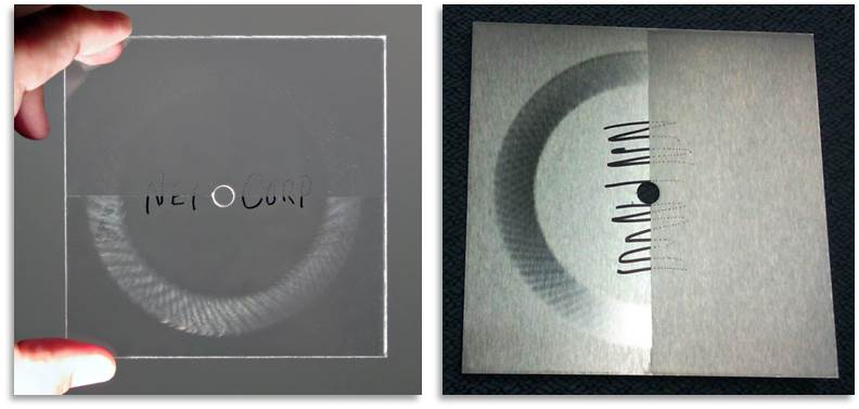 SR-100EC half-coated polycarbonate (left) and stainless steel plate (right) after 500 cycles of Taber abrasion testing